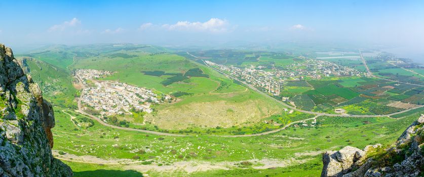 Panoramic landscape view form Mount Arbel, with Wadi Hamam village, Migdal and the Sea of Galilee. Northern Israel