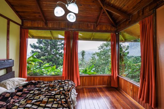 Vara Blanca, Costa Rica - January 13, 2020 : Interior of a room in Volcan Poas Tiquicia Lodge, a three-star lodge featuring bungalows with volcano views and located close to La Paz Waterfall.
