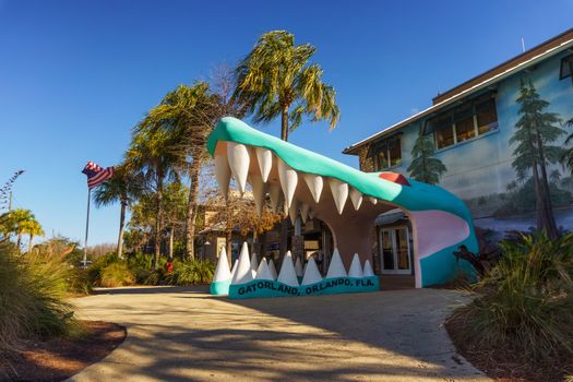 Orlando, Florida, USA - February 9, 2020 : Large alligator head at the main entrance to Gatorland theme Park and wildlife preserve located along South Orange Blossom Trail south of Orlando.