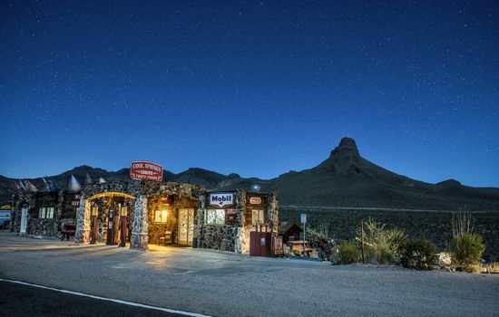 COOL SPRINGS, ARIZONA, USA - MAY 19, 2016 : Night sky with many stars above rebuilt Cool Springs station in the Mojave desert on historic route 66 in Arizona