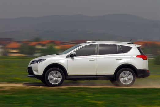 small Off-road car driving madly fast in the country