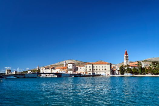 View of the stone bridge and historic buildings of the city of Trogir in Croatia