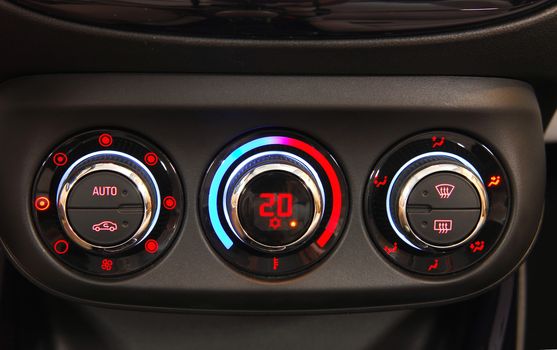 manual switches the air conditioning on the dashboard of the car