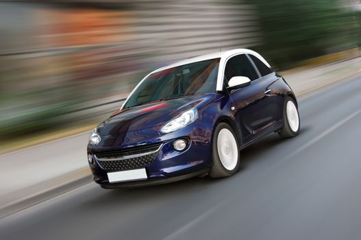 A panning shot of a speeding blue car
