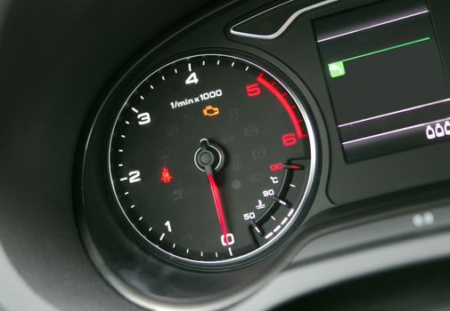 Car Tachometer photographed in a car that stands