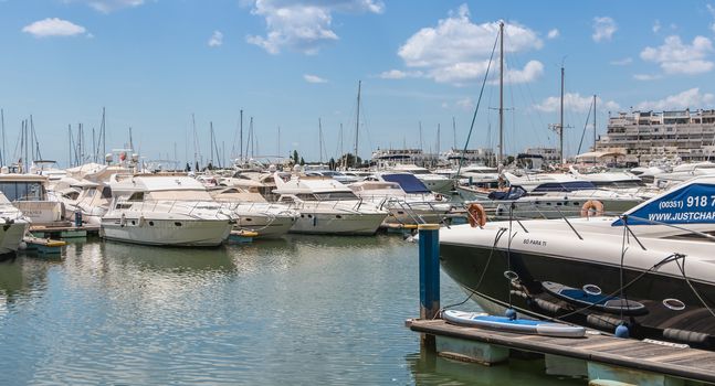 Vilamoura, Portugal - May 1, 2018: View of the luxurious marina of Vilamoura, in the south of Portugal, where are moored superb yoat on a spring day