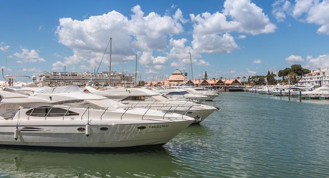 Vilamoura, Portugal - May 1, 2018: View of the luxurious marina of Vilamoura, in the south of Portugal, where are moored superb yoat on a spring day