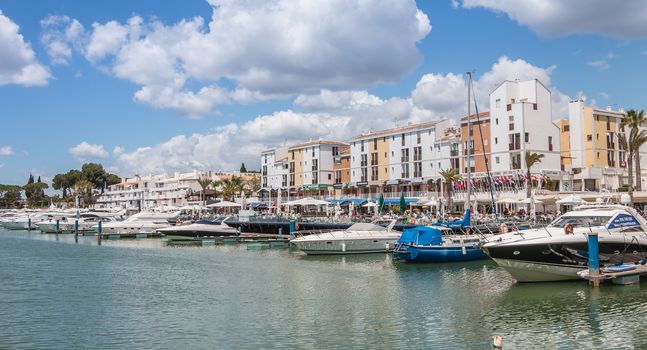 Vilamoura, Portugal - May 1, 2018: View of the luxurious marina of Vilamoura, in the south of Portugal, where are moored superb yoat on a spring day