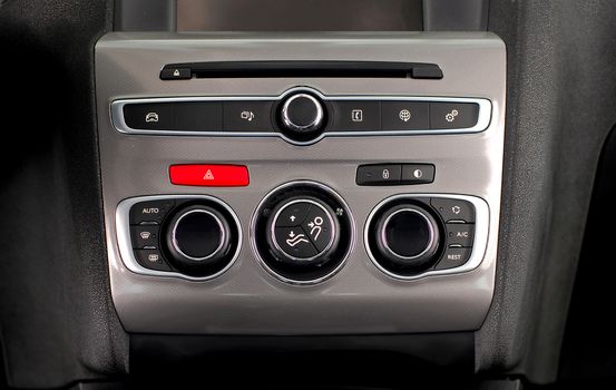 manual switches the air conditioning on the dashboard of the car