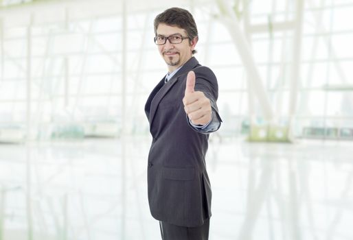 young business man going thumb up, at the office