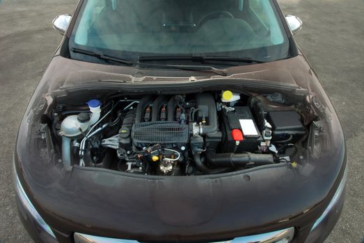 gasoline engine in the gray passenger car