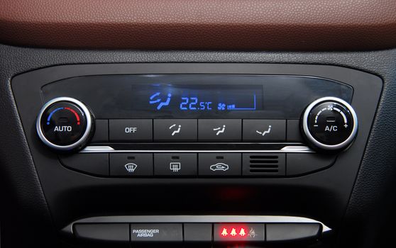 manual switches the air conditioning on the dashboard of the car