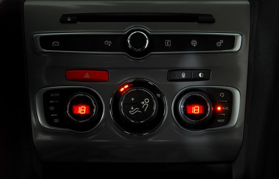 manual switches the air conditioning on the dashboard of the car