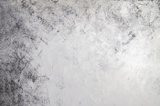 Concrete white gray background with scuffs and black splashes. Textured wall texture in the grunge style.