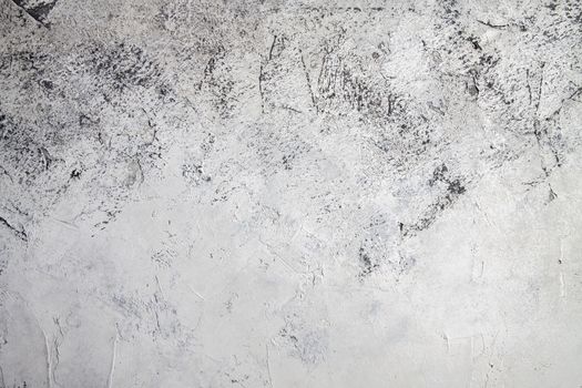Concrete white gray background with scuffs and black splashes. Textured wall texture in the grunge style.