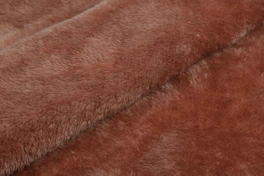 Abstract Artificial texture fur fabric, background, closeup. Fluffy material backdrop, kids toys faux fur.