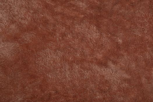 Abstract Artificial texture fur fabric, background, closeup. Fluffy material backdrop, kids toys faux fur.