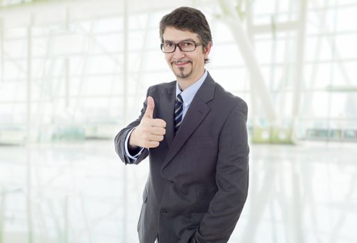 young business man going thumb up, at the office