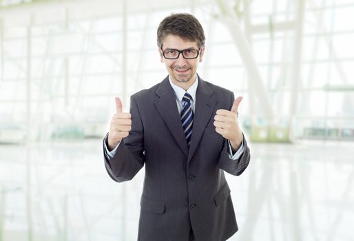 young business man going thumb up, at the office