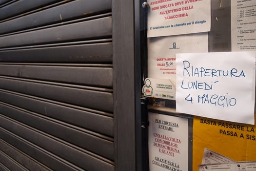 Cremona, Lombardy, Italy - April 30 th - May 1st 2020 - closed bars  and general commerce  during coronavirus lockdown and economic crisis. Italian signs