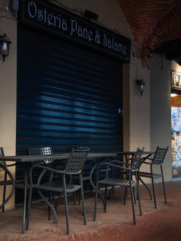 Cremona, Lombardy, Italy - April 30 th - May 1st 2020 - closed bars  and general commerce  during coronavirus lockdown and economic crisis. Italian signs