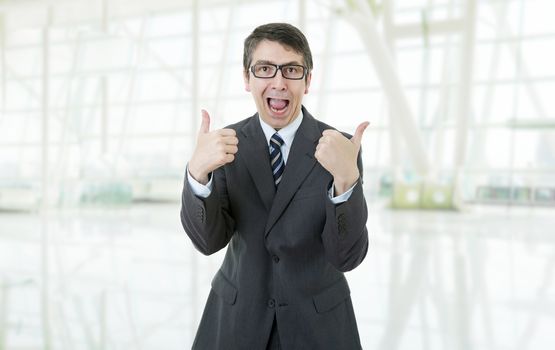 young business man going thumb up, at the office