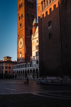 Cremona, Lombardy, Italy - April 30 th - May 1st 2020 - people biking walking dog walking in the center during covid 19  lockdown and economic crisis in Lombardy affected region.