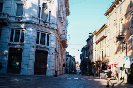 Cremona, Lombardy, Italy - April 30 th - May 1st 2020 - people biking walking dog walking in the center during covid 19  lockdown and economic crisis in Lombardy affected region.