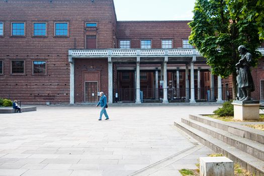 Cremona, Lombardy, Italy - April 30 th - May 1st 2020 - people biking walking dog walking in the center during covid 19  lockdown and economic crisis in Lombardy affected region.