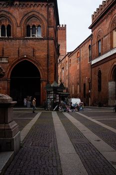 Cremona, Lombardy, Italy - April 30 th - May 1st 2020 - people biking walking dog walking in the center during covid 19  lockdown and economic crisis in Lombardy affected region.