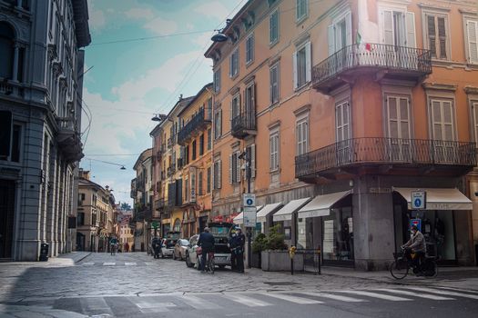 Cremona, Lombardy, Italy - April 30 th - May 1st 2020 - people biking walking dog walking in the center during covid 19  lockdown and economic crisis in Lombardy affected region.