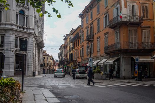 Cremona, Lombardy, Italy - April 30 th - May 1st 2020 - people biking walking dog walking in the center during covid 19  lockdown and economic crisis in Lombardy affected region.