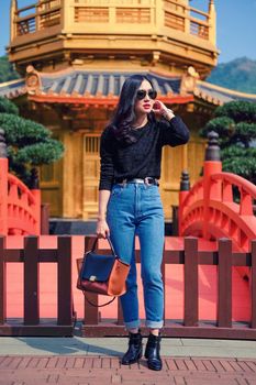 Woman in Front View The Golden Pavilion Temple in Nan Lian Garden