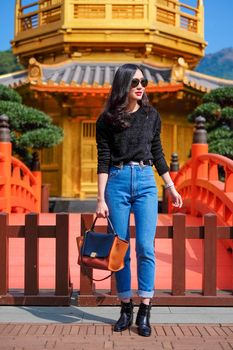 Woman in Front View The Golden Pavilion Temple in Nan Lian Garden