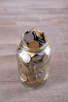 Finance or saving conceptual with coins in jar glass.