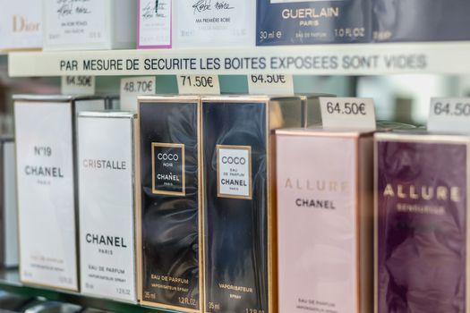 Noirmoutier, France - July 3, 2017: Detail of a showcase of a luxury perfume store in the city center on a summer day