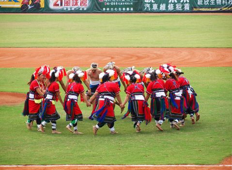 PINGTUNG, TAIWAN, APRIL 8: Aboriginal dancers perform before a Pro Baseball League game between the President Lions and the Lamigo Monkeys. The Lions won 2:0 on April 8, 2012 in Pingtung. 
