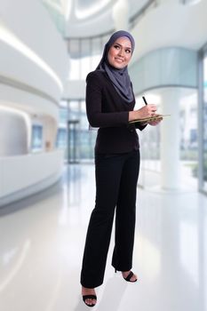 Lifestyle of attractive Muslim business woman with tablet. Effective, active, innovative with growth of finance conceptual