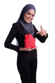 Young pretty Business muslim woman hold home icon for investment conceptual