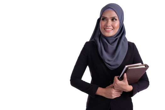 Attractive muslim business woman with finance diary