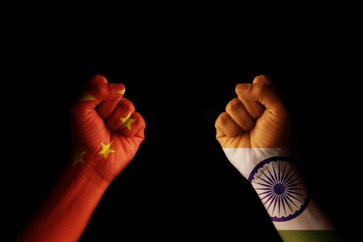 Concept of Dispute or conflict between India and China showing with fist hands