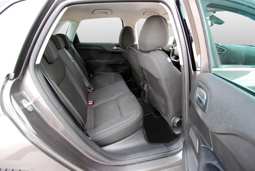 car interior, black rear seat in the passenger car