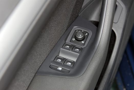 side mirror switch control, car interior detail