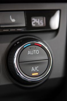 manual switches the air conditioning on the dashboard of the car