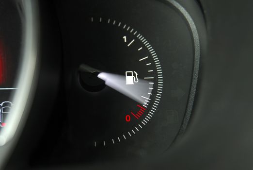 Close-up shot of a fuel gauge in a car