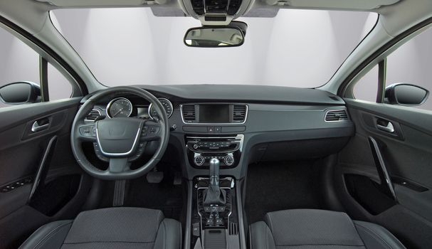 studio shot passenger car interior, front view