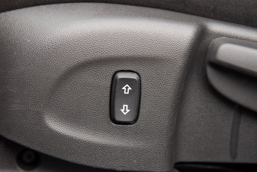 Buttons for adjusting seat position. Car interior detail
