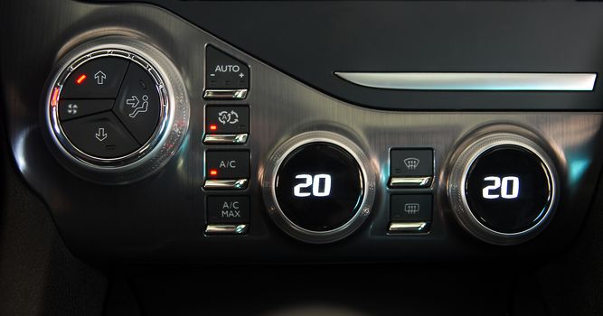 manual switches the air conditioning on the dashboard of the car