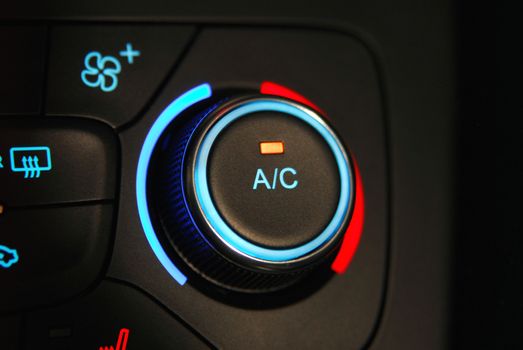 manual switches the air conditioning on the dashboard of the car