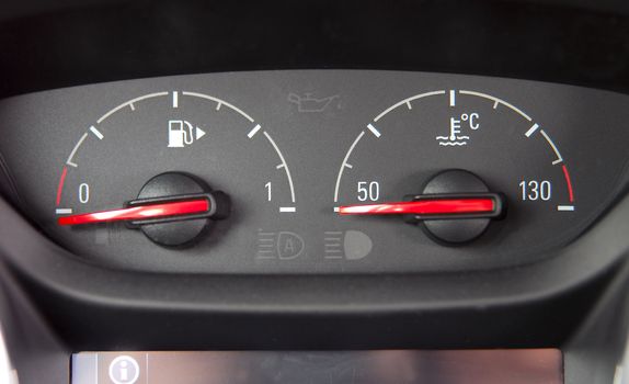 analog instruments for the amount of fuel and the temperature in the car